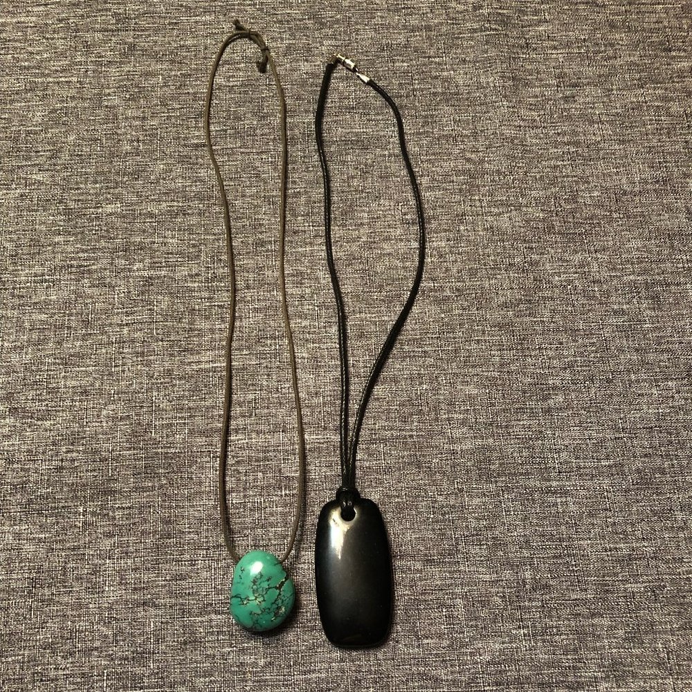 Two necklaces with stone pendants on cords - sold together